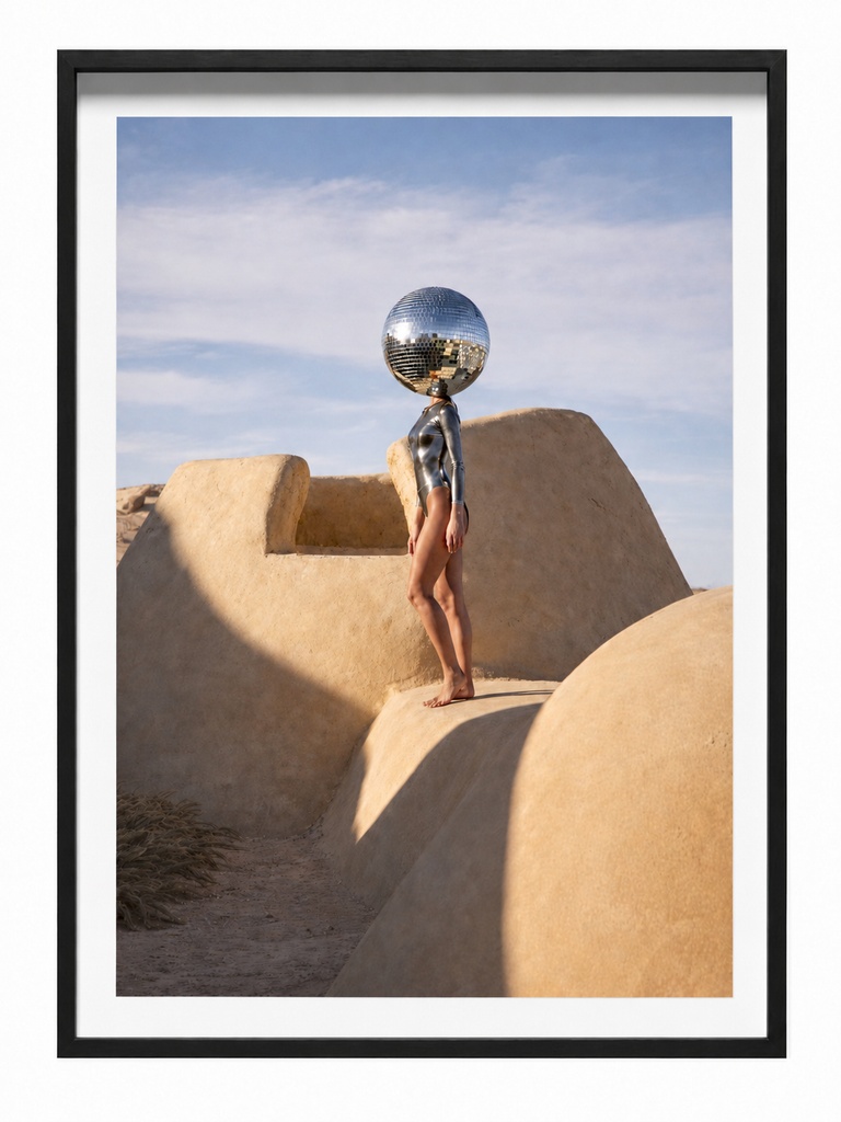 Helios Mirror figure with mirror ball desert landscape framed photographic print in black frame