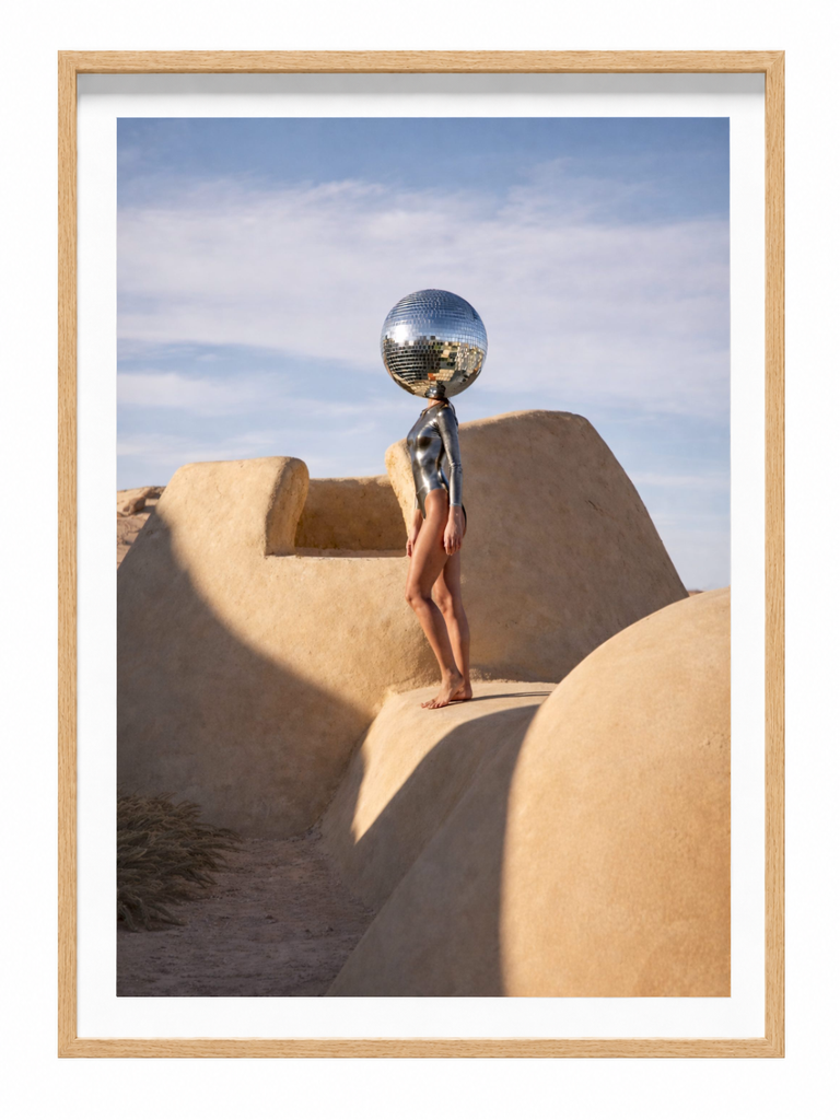Helios Mirror figure with mirror ball desert landscape framed photographic print in oak frame
